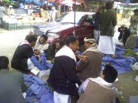 Traders set up a pitch to sell qat in whatever free spot they can find in the qat market