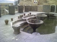 The gardens and fountains of Al Hagar that look out across the valley